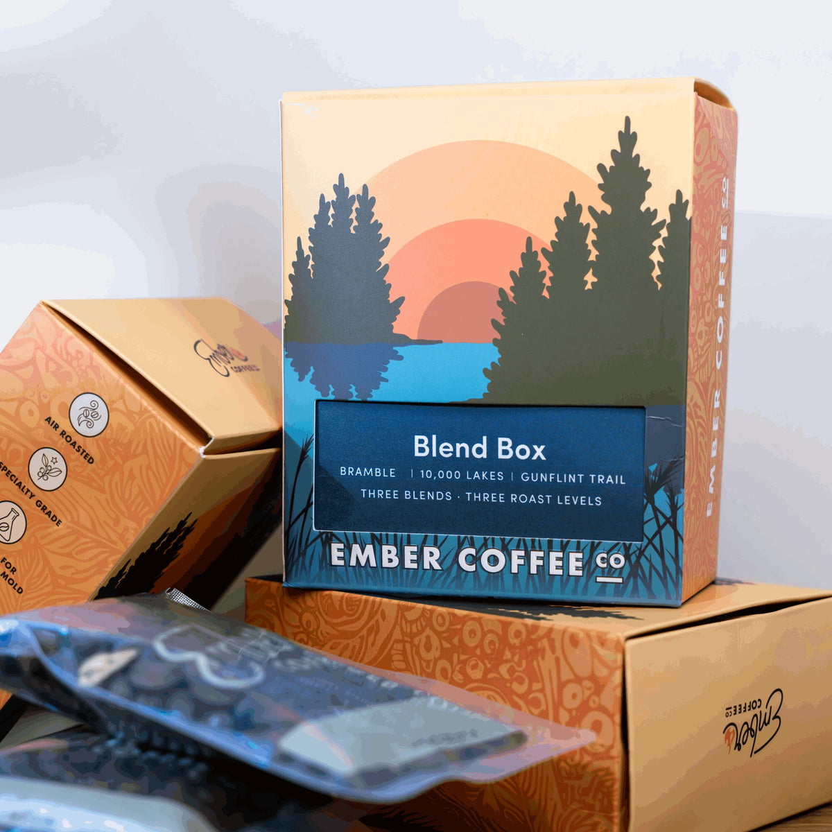 Ember Coffee Blend Box stacked with Discovery Boxes and a sample bag