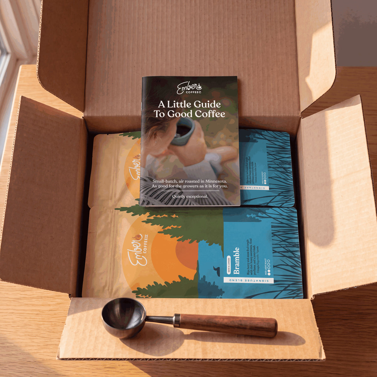 Ember Essentials Set, open box with two bags, brew guide and scoop, top-down view