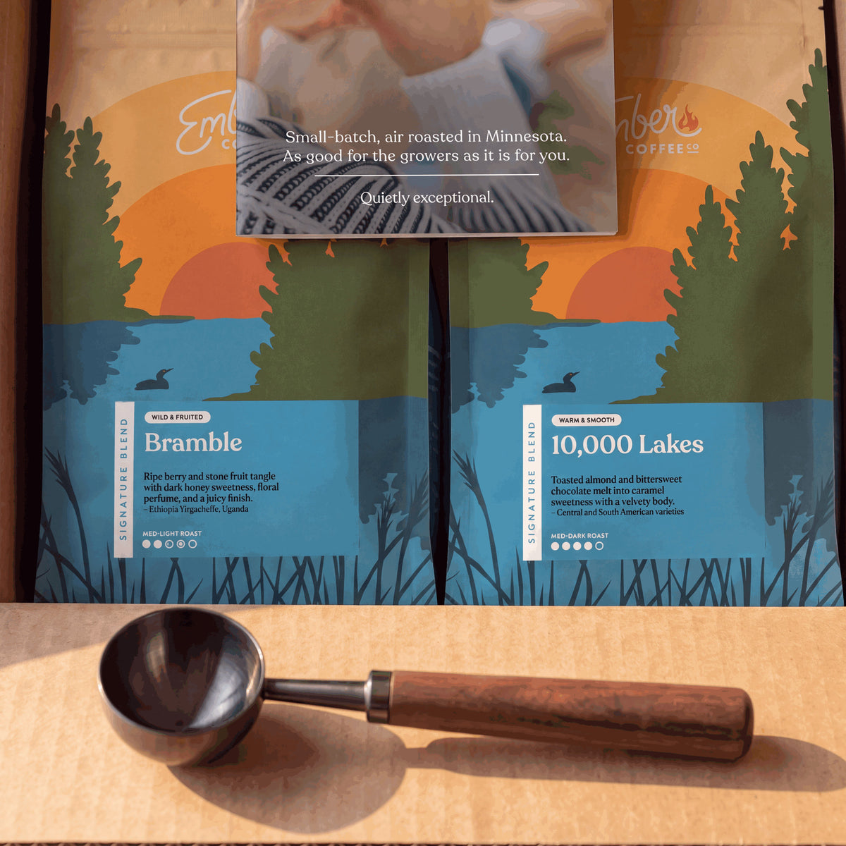 Ember Essentials Set, close-up of Bramble and 10,000 Lakes bags with coffee scoop