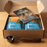 Ember Essentials Set, open box with two bags, brew guide and scoop, front angle