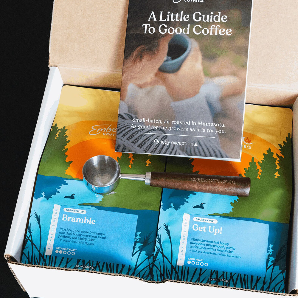 Ember Coffee Light Roast Kit from above with guide, walnut scoop and Bramble and Get Up! 12 oz bags