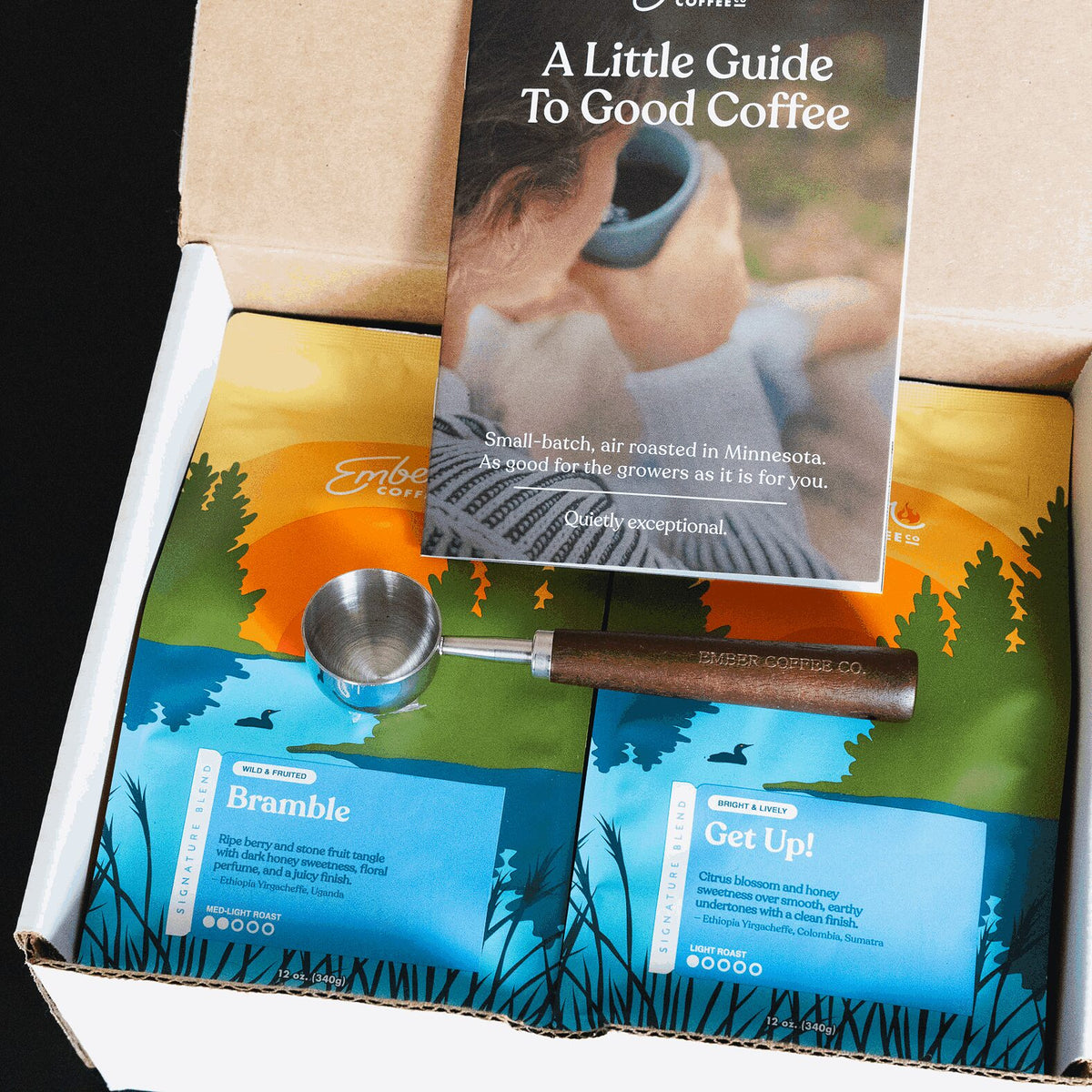 Ember Coffee Light Roast Kit from above with guide, walnut scoop and Bramble and Get Up! 12 oz bags
